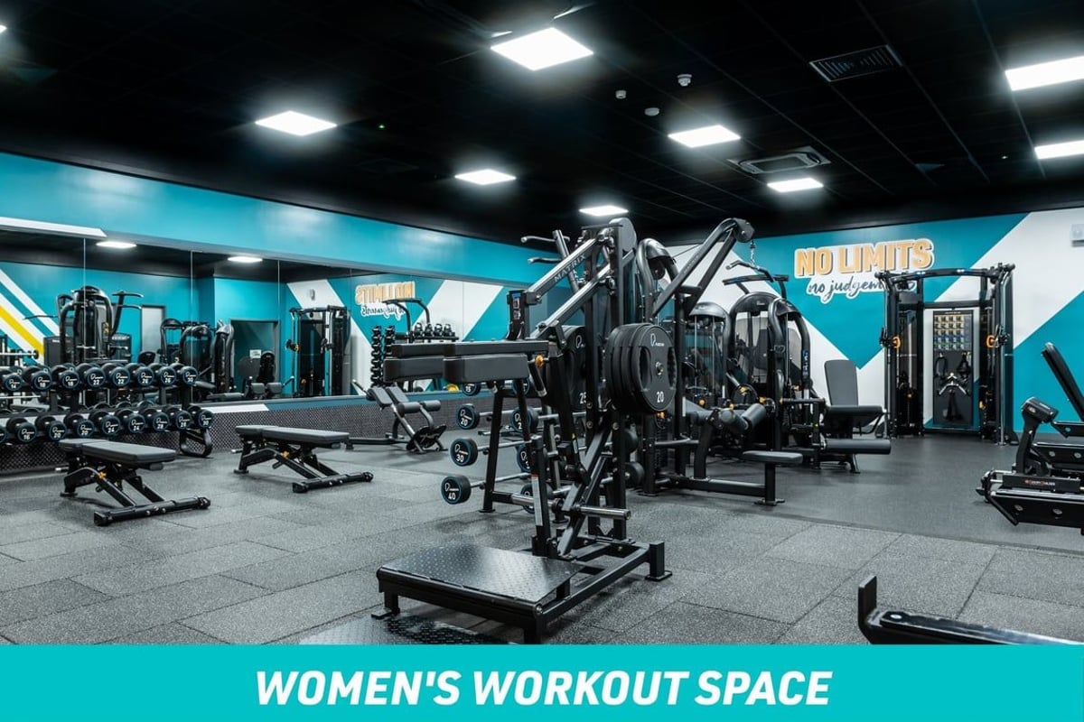 PureGym Weston Super Mare Women's Workout Space: Dumbbells, benches and standing calf press machine along with other fixed pin machines