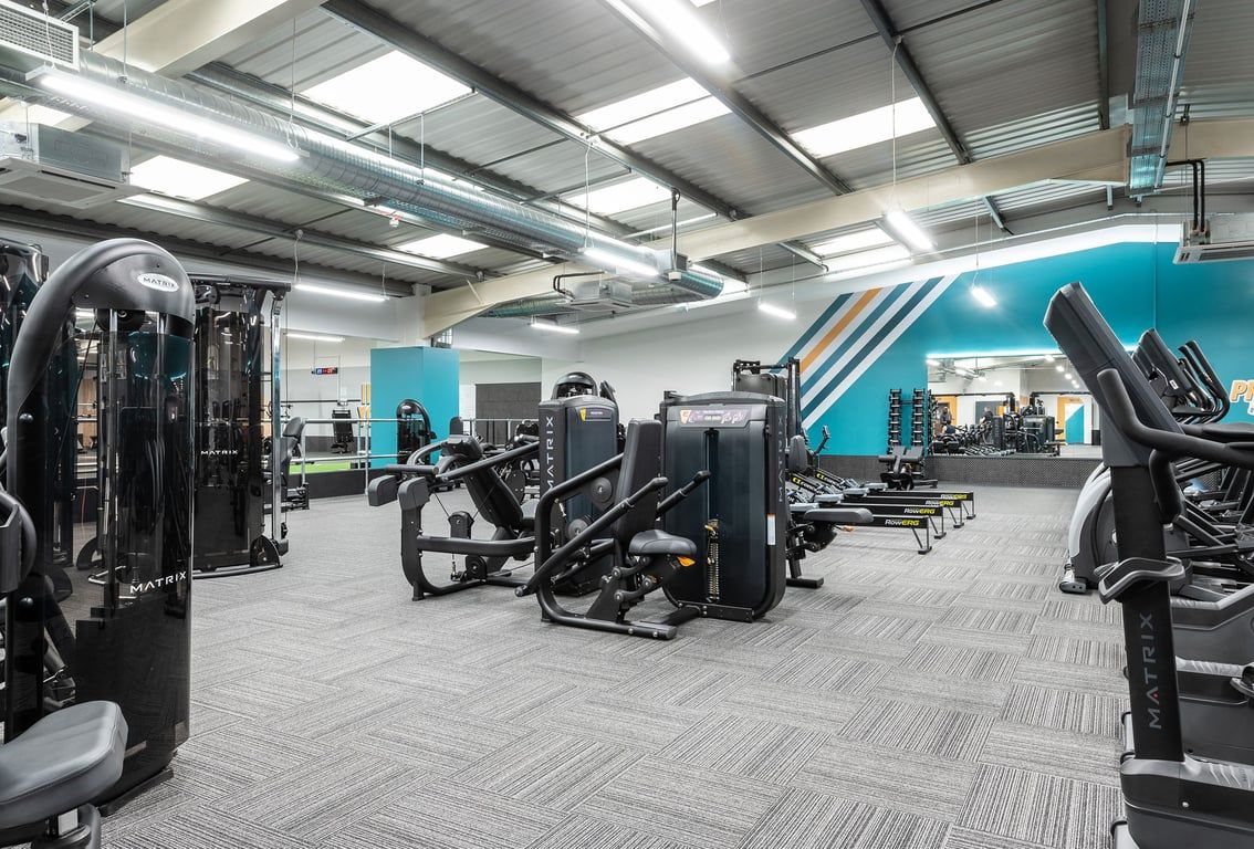 PureGym Cardiff Western Avenue: Weight machines, resistance equipment, rubberized flooring, and mirrored walls.