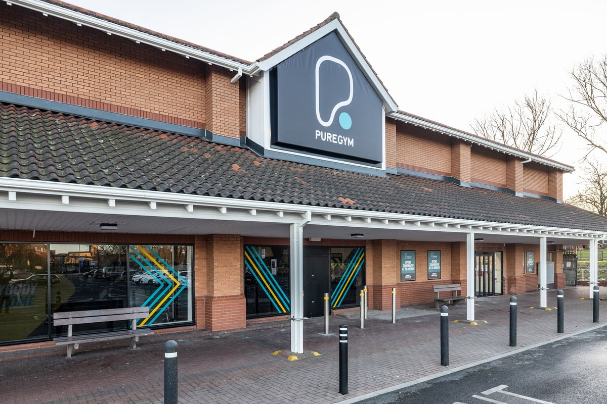 PureGym Hartlepool: Front of fitness center with blue signage, brick exterior, and angled window displays.