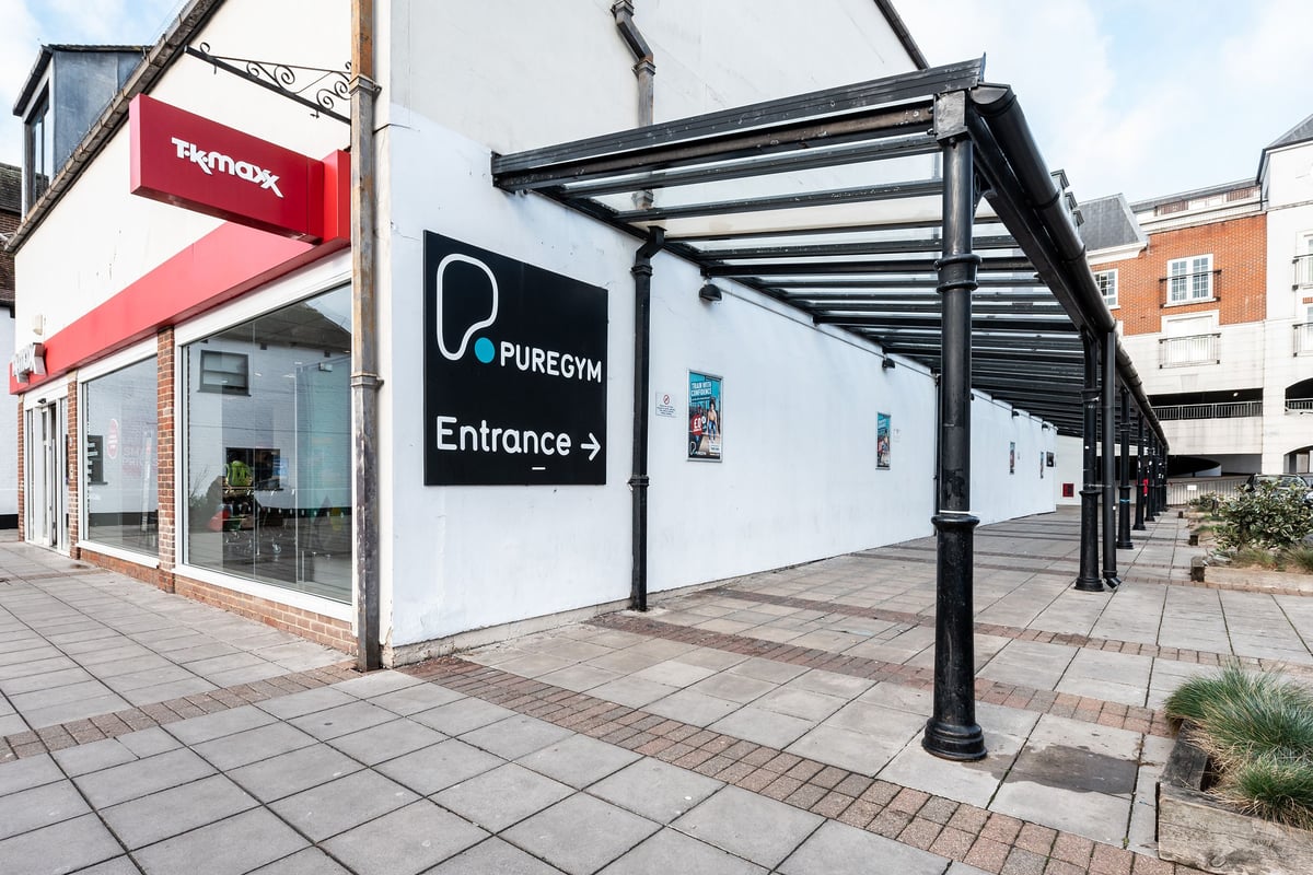 PureGym Epsom: Gym exterior with signage for "PureGym" entrance and covered walkway.