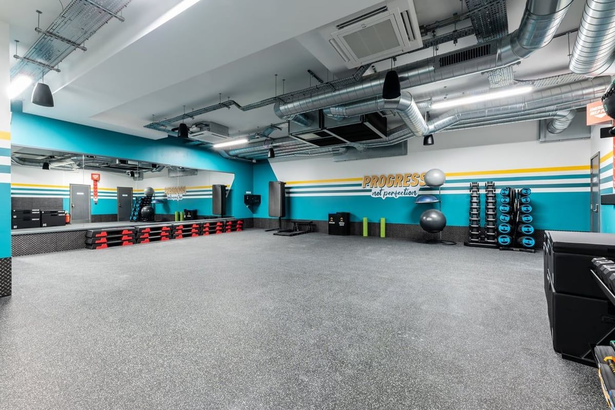 PureGym London Palmers Green: Rubberised flooring, colourful weight plates, exercise balls, resistance bands, wall graphics.