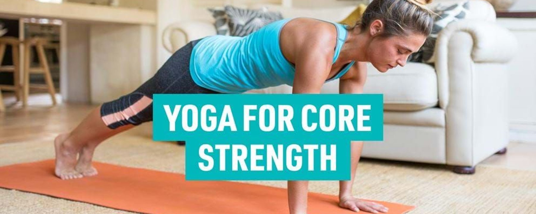 Woman in blue top and black leggings doing plank pose on orange yoga mat indoors