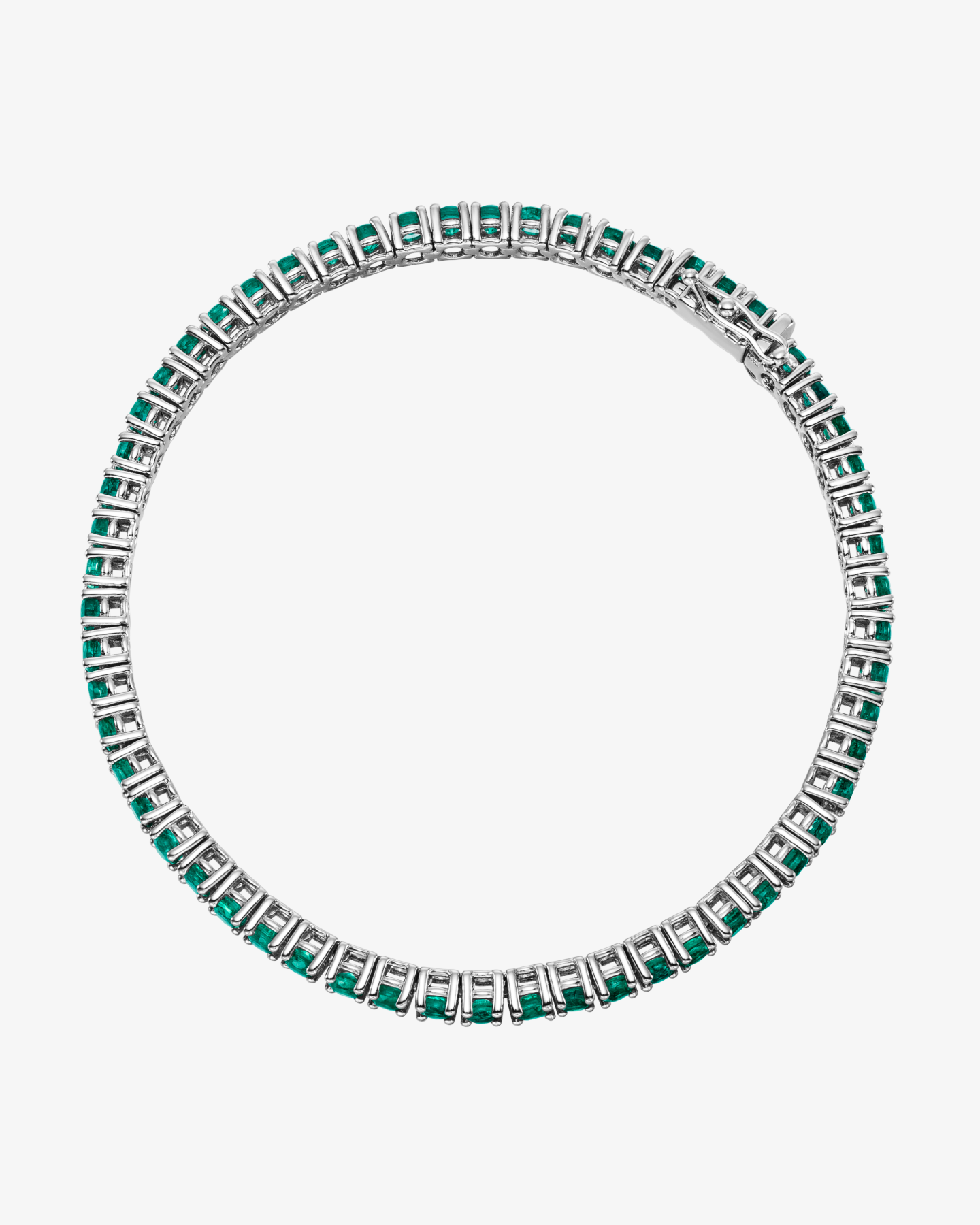 Bransoletka tenisowa ze szmaragdami - białe złoto