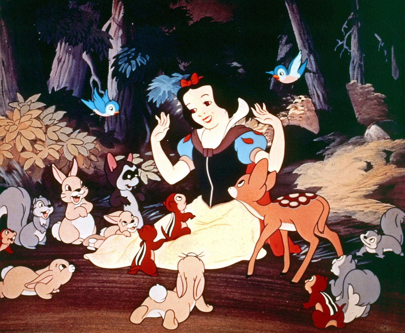 Frame from Snow White showing woman surrounded by forest animals