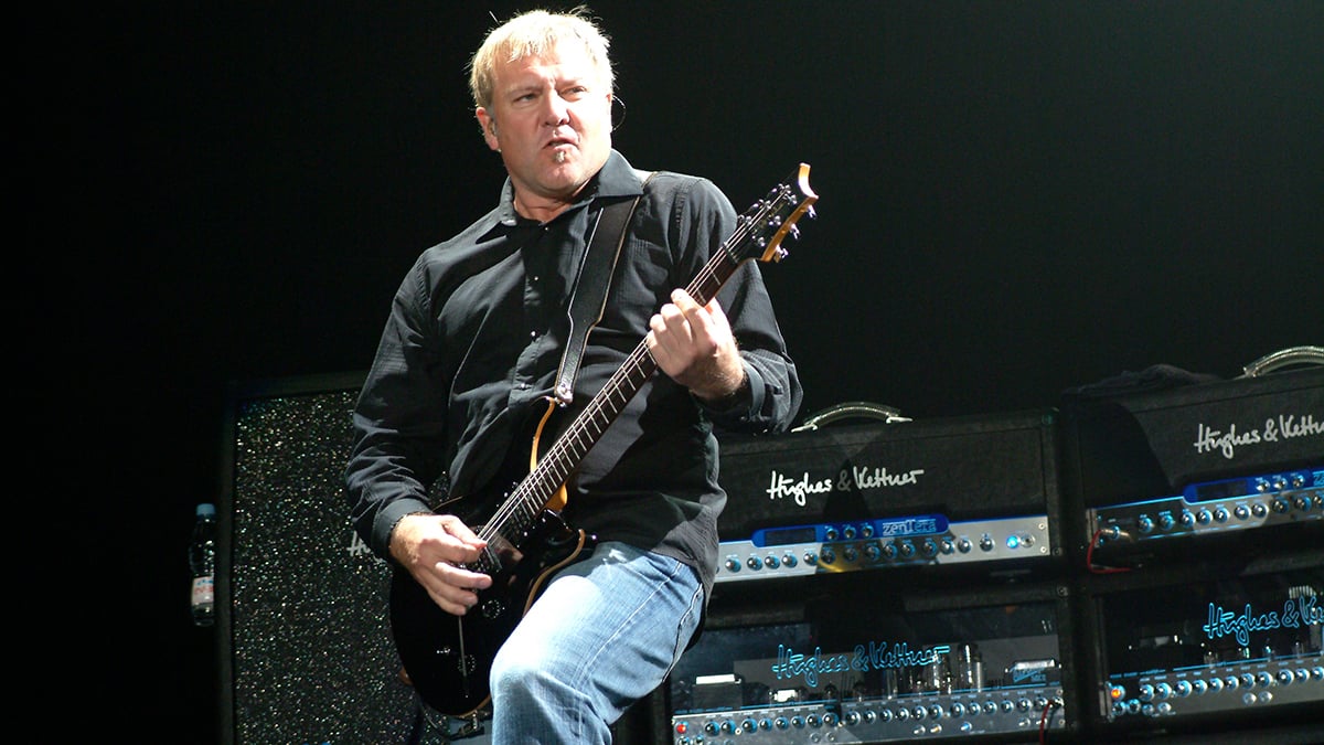 Alex Lifeson performing live onstage, with Hughes & Kettner amplifiers behind