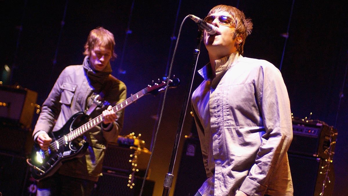 Andy Bell (L) and Liam Gallagher (R) of Oasis perform at Shoreline Amphitheatre in Mountain View, California on September 11, 2005