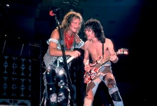 David Lee Roth (left) and Eddie Van Halen perform onstage at the Jacksonville Coliseum in Jacksonville, Florida on January 18, 1984