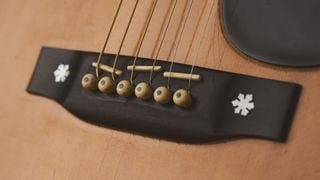 A close-up of the unusual triple saddle bridge