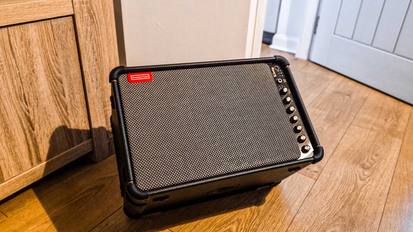 A Positive Grid Spark Live on a wooden floor