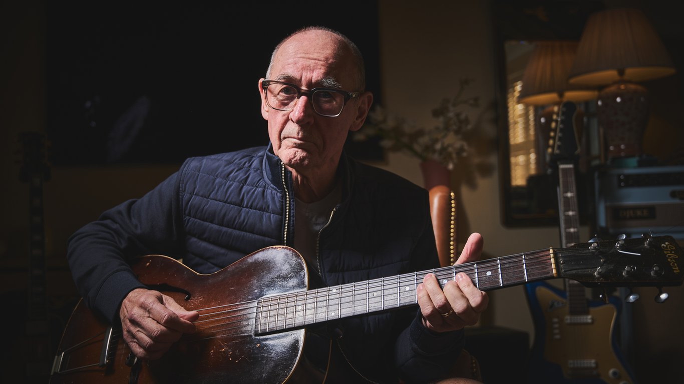 Andy Fairweather Low poses with his Gibson guitars