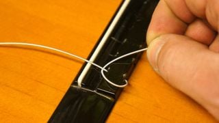 Removing the old strings on a classical guitar