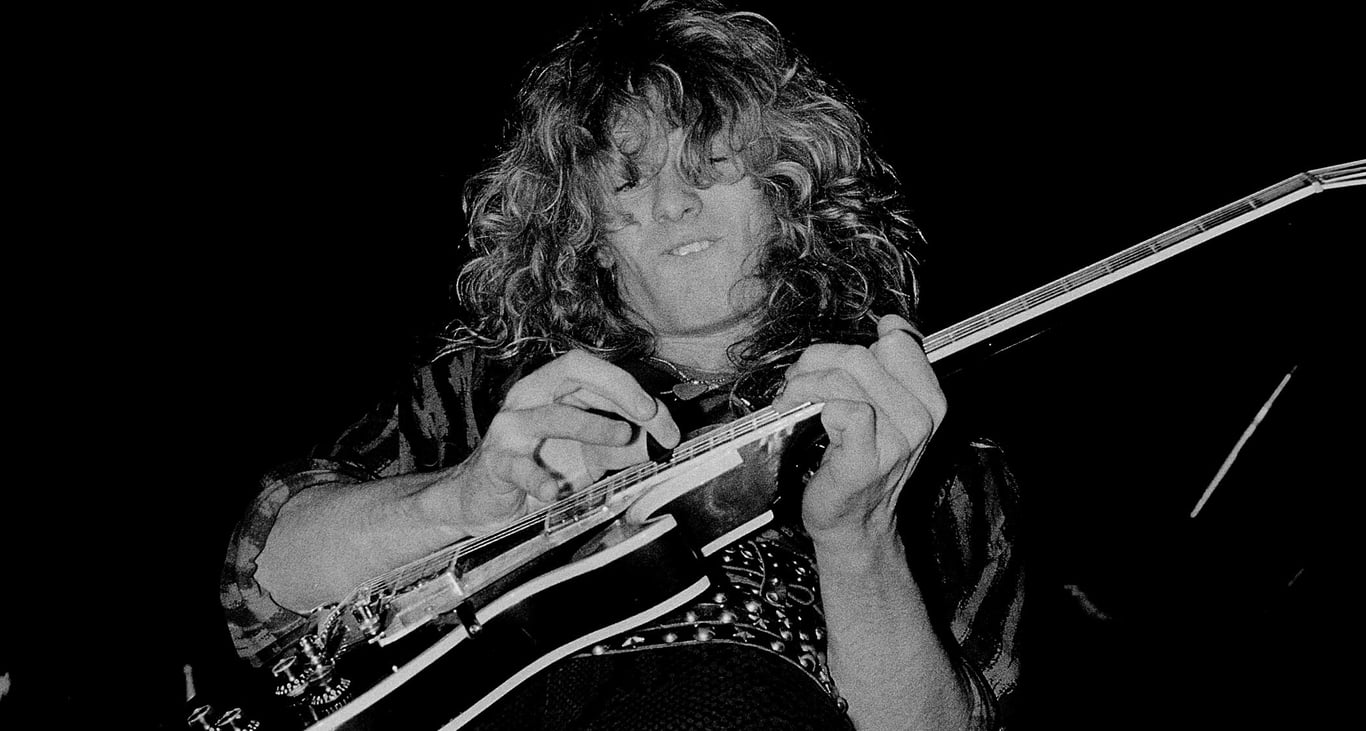 John Sykes solos on his Gibson Les Paul Custom and it looks like he might even be two-hand tapping &ndash; this was the '80s, and this black-and-white image captures him in action on Whitesnake's 1984 tour in Chicago.