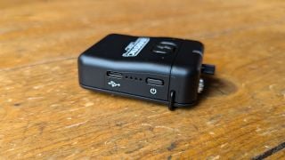 The receiver of the Cloudvocal EverSync Wireless IEM on a wooden floor