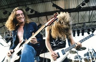 Cliff Burton (left) and James Hetfield perform onstage with Metallica
