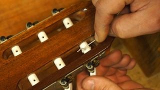 Secure a nylon guitar string
