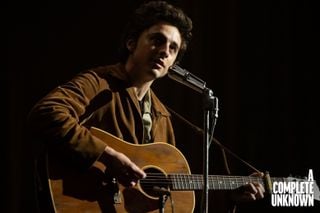 Timoth&eacute;e Chalamet, in a scene from the forthcoming film, A Complete Unknown. Chalamet is playing one of two Gibson J-50 models made specifically for the film