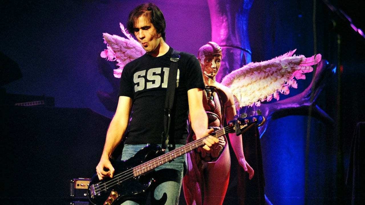 Krist Novoselic of Nirvana performs onstage at Pier 28 in Seattle, Washington in December 1993