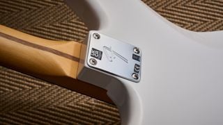 The neck plate of the Fender Player II Jaguar
