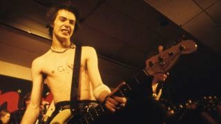 Photo of Sid VICIOUS and SEX PISTOLS, Sid Vicious performing live onstage at Randy's Rodeo Nightclub, San Antonio, on final tour