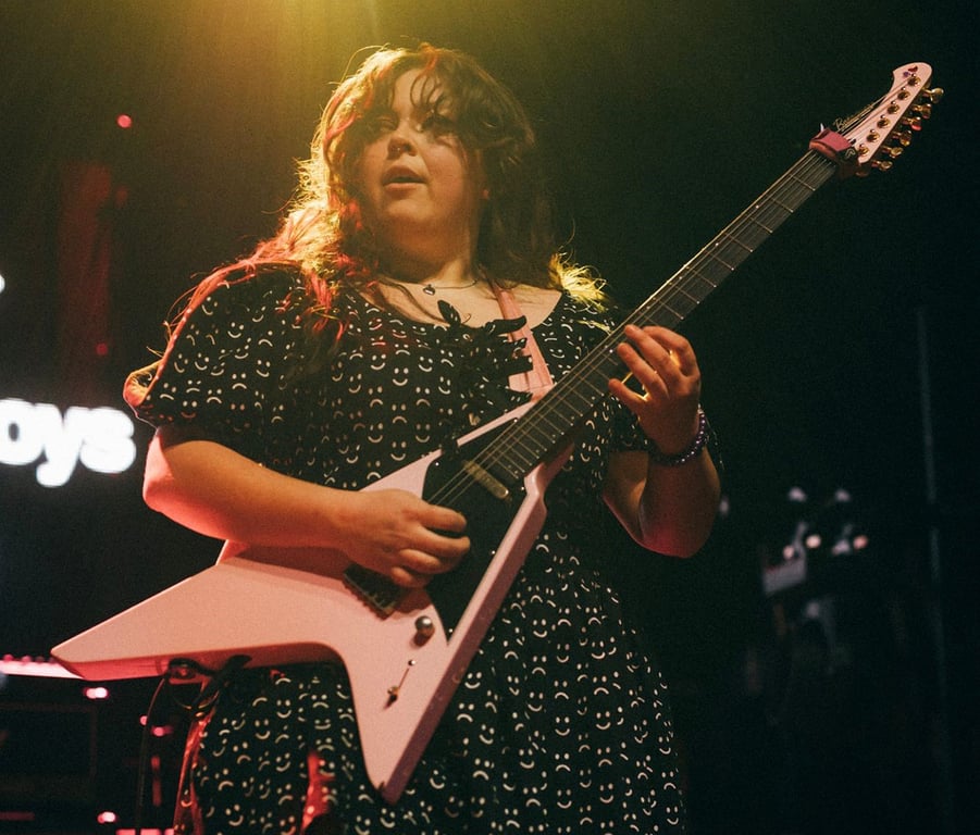 Maddie Caffrey performs onstage with the Callous Daoboys