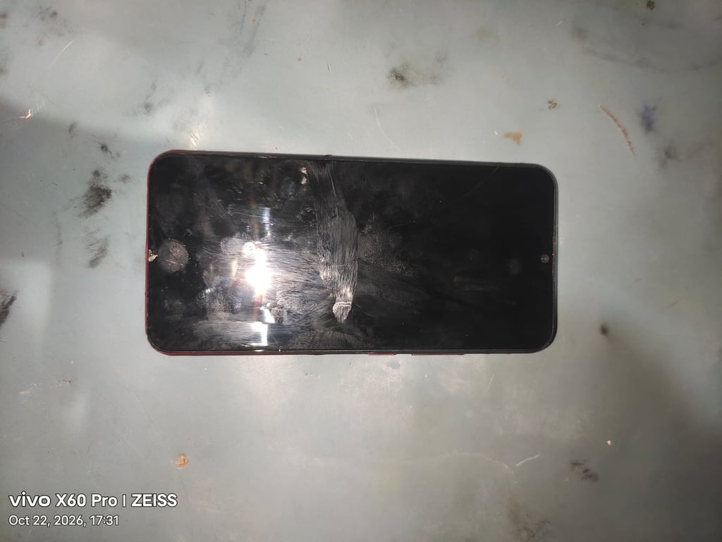 Android Smartphone with Waterdrop Notch, Red Frame (brand and model not visible)