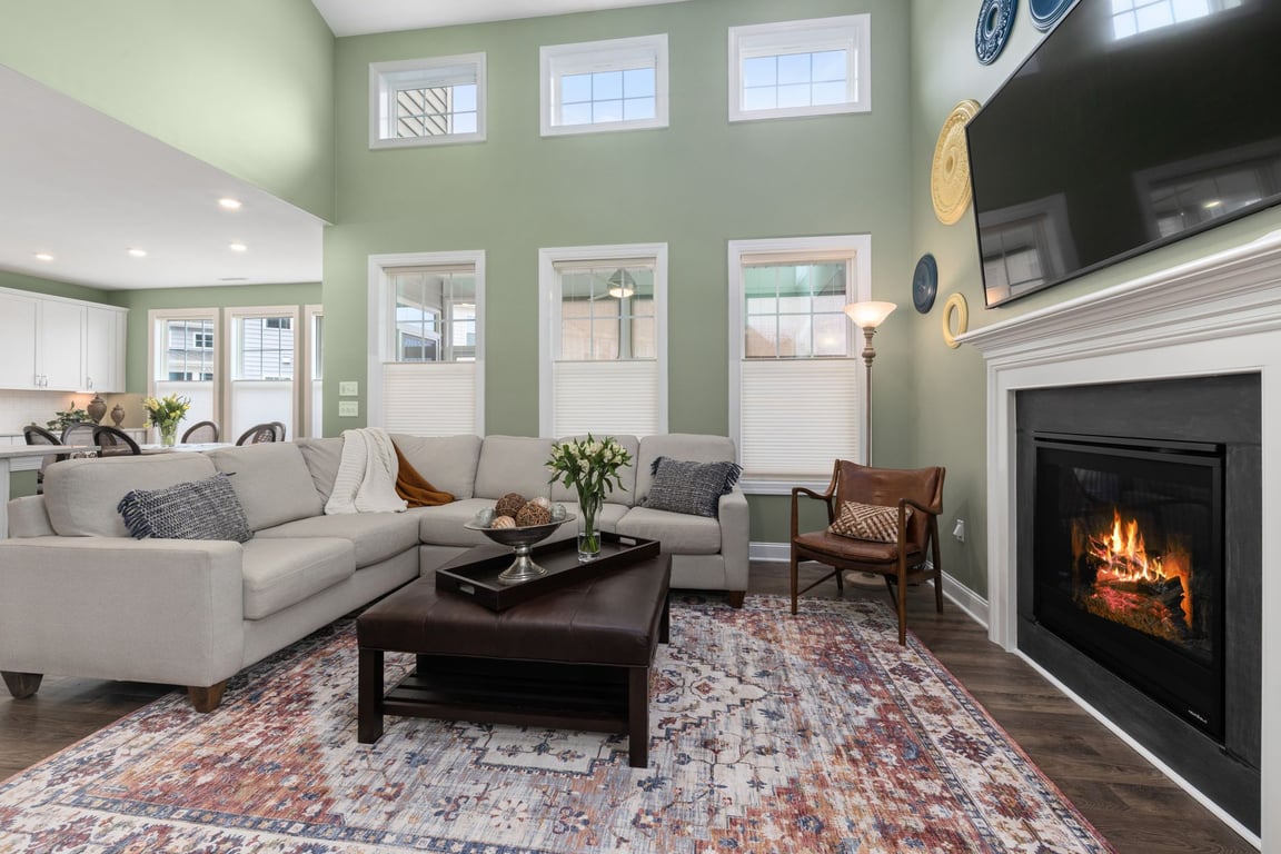 Stylish living room with fireplace and sectional sofa, showing a cozy home setting suitable for family cancer treatment context