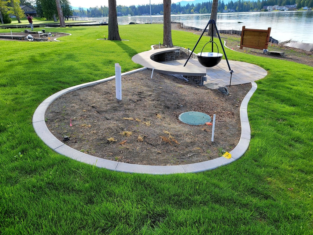 Curbing framing an area with a firepit
