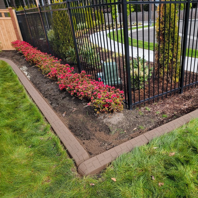 Red brick curbing in front of some flowers