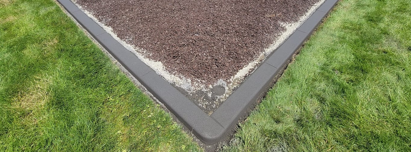 Fresh curbing on the edge of a playground