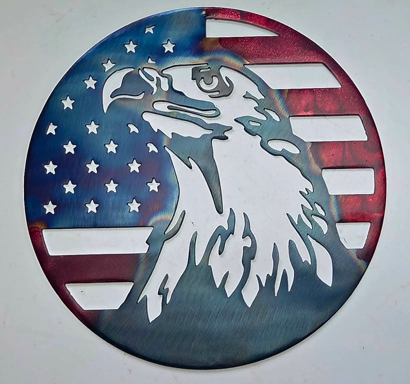 Metal art of an eagle with the american flag in a round design