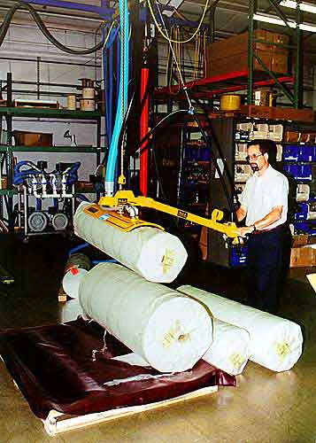 ANVER vacuum lifter with curved pad attachment for lifting curved surfaces