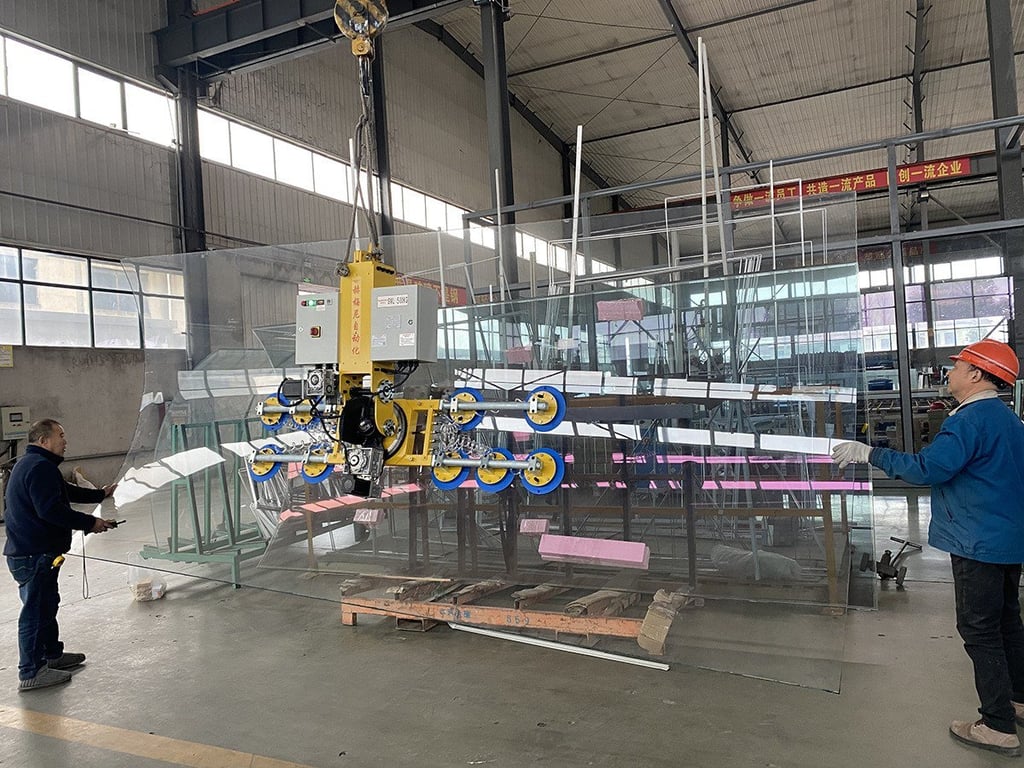Powered tilting and rotating of curved glass