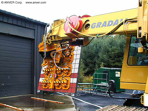 Gradall excavator vacuum end-effector placing panels in a tunnel