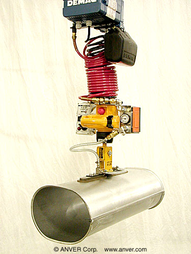 Two pad gravity tilt attachment handling a muffler