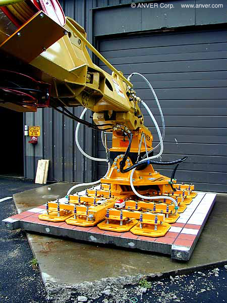 Gradall excavator vacuum end-effector placing panels in a tunnel