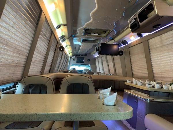 18 Passenger Luxury Limo Bus Luxury Rental for Group Celebrations - Anniversary - Featured image