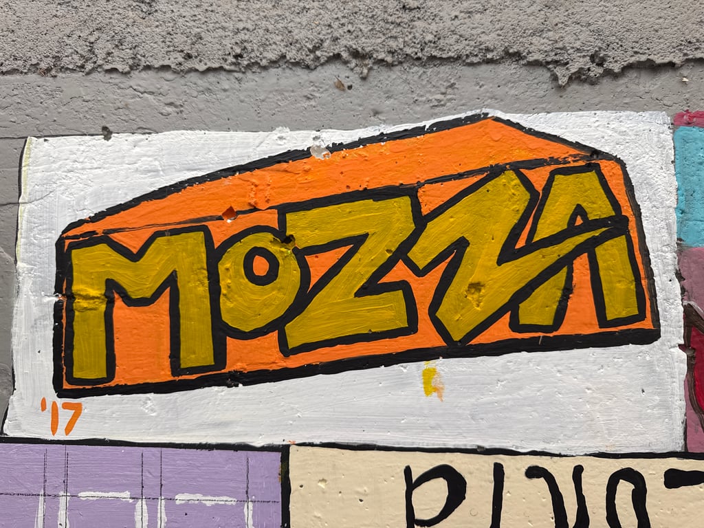 Mozza's brick on the Camp Rotary walkway