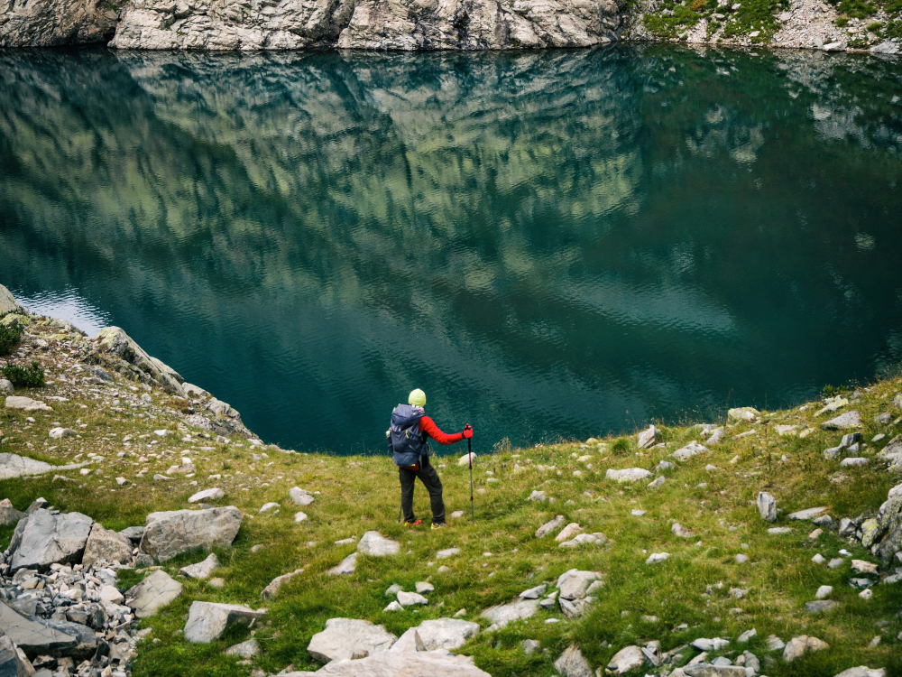 Hikers on a mountain trail above Nohur Lake in the Caucasus Mountains near Gabala, Azerbaijan, in summer