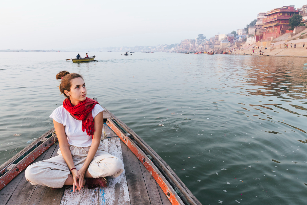 Varanasi Ganga Aarti ceremony at dawn with fire and flowers on the ghats of the River Ganges, Uttar Pradesh, India