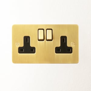 Lucian double socket with black inserts in top brass