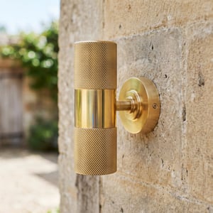 Up and down Portreath IP65 wall light in knurled brass