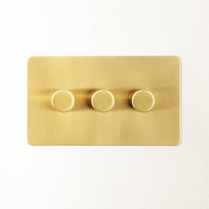 Lucian three gang dimmer switch in top brass