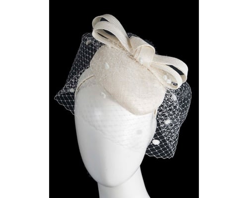 Cream pillbox hat with veil by Fillies Collection