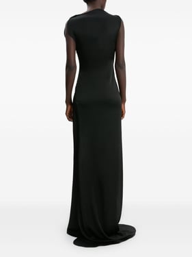 Long maxi dress in black crepe with side slit and asymmetrical neckline.