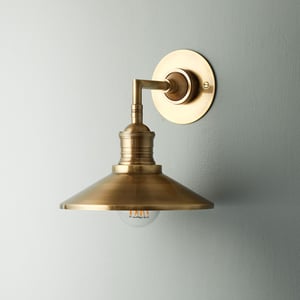 Whizzer wall light in antique brass