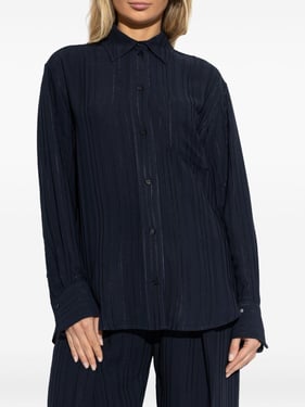 Navy blue ribbed jacquard pajama-style shirt with contrasting logo embroidery on the cuff.