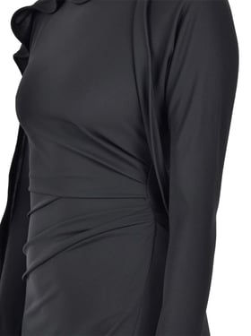 Long draped dress in black viscose jersey.