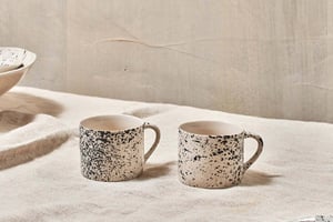 nkuku Ama Short Splatter Mug Set Of 2 | Tableware | Off White/Black