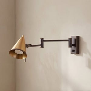 Conrad articulated wall light in bronze with brass hood