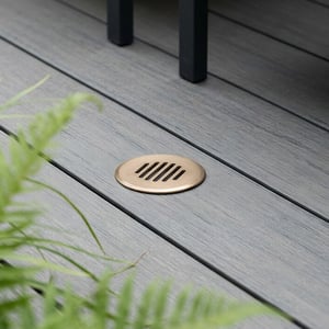 Grille IP67 recessed deck light in aged brass